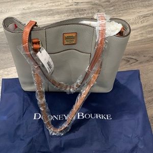 Dooney & Bourke. Small Lexington smoke colored purse. NEW W/ TAGS AND DUST BAG.
